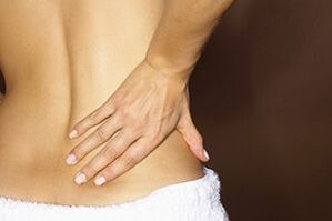 lower back pain symptom of osteochondrosis